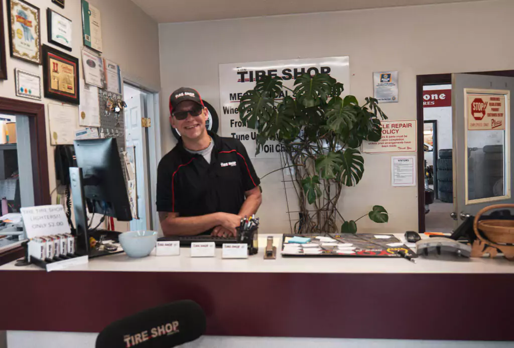 The tire shop team posing together, ready to service customers' vehicles.