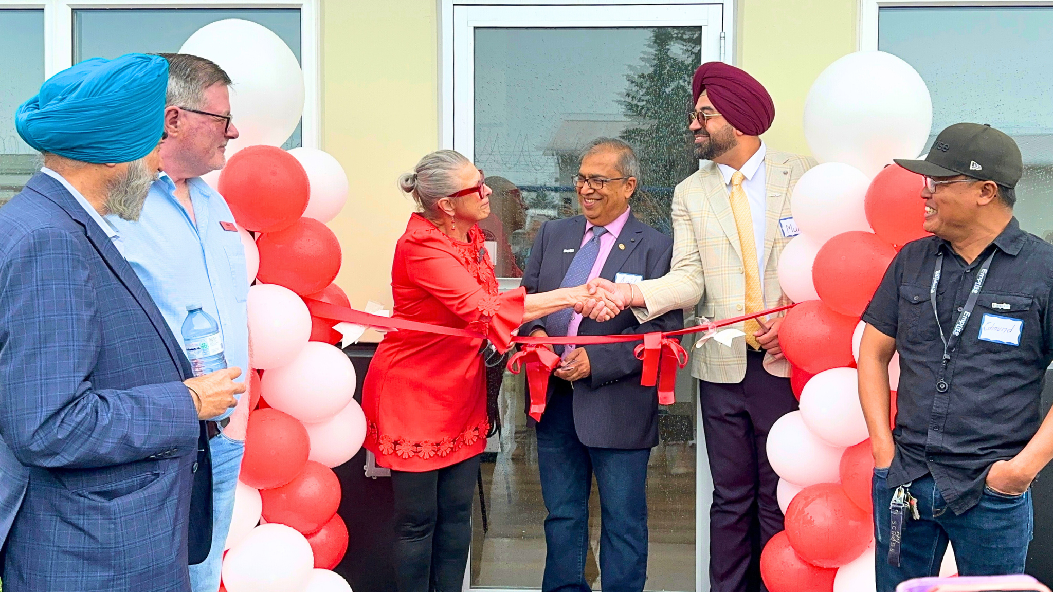 Ribbon cutting with Mayor Judy Dahl and the owners of Emprise Canada Inc (Anil Jain and Mukhdeep Mangat)